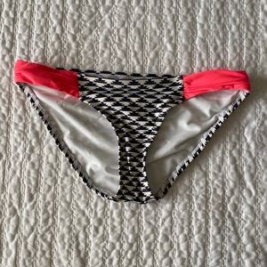 Blue and white geometric print bikini bottoms with bright pink side detailing